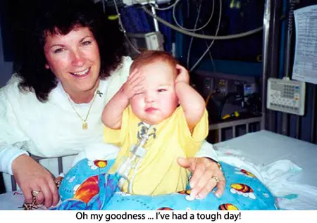 A woman and child in hospital bed with the caption " oh my goodness i 've had a tough day ".
