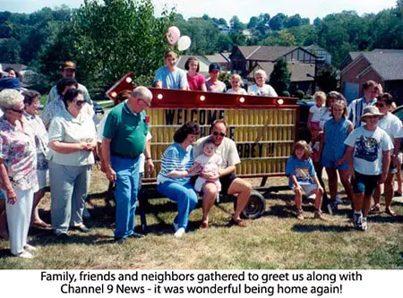 A group of people gathered around a bench.